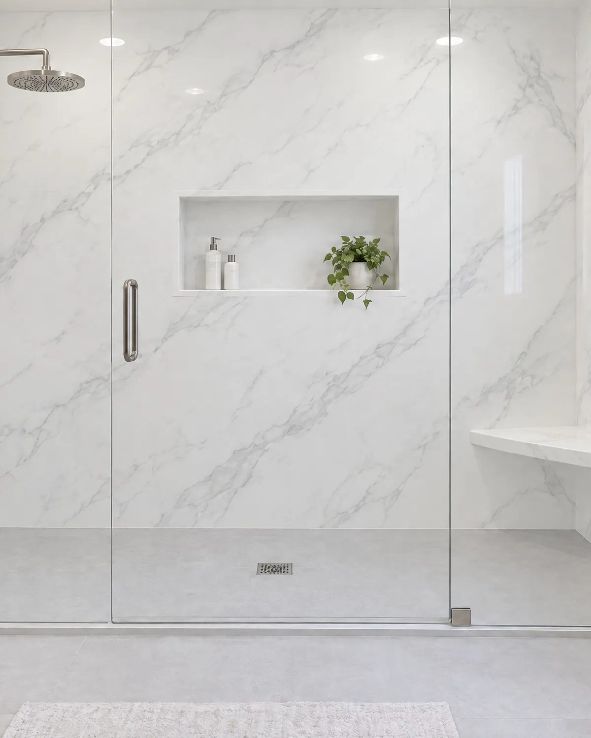 Walk-in shower with marble-look solid surface walls